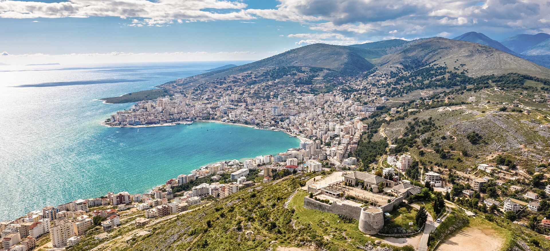 A breathtaking cityscape overlooking a tranquil body of water.